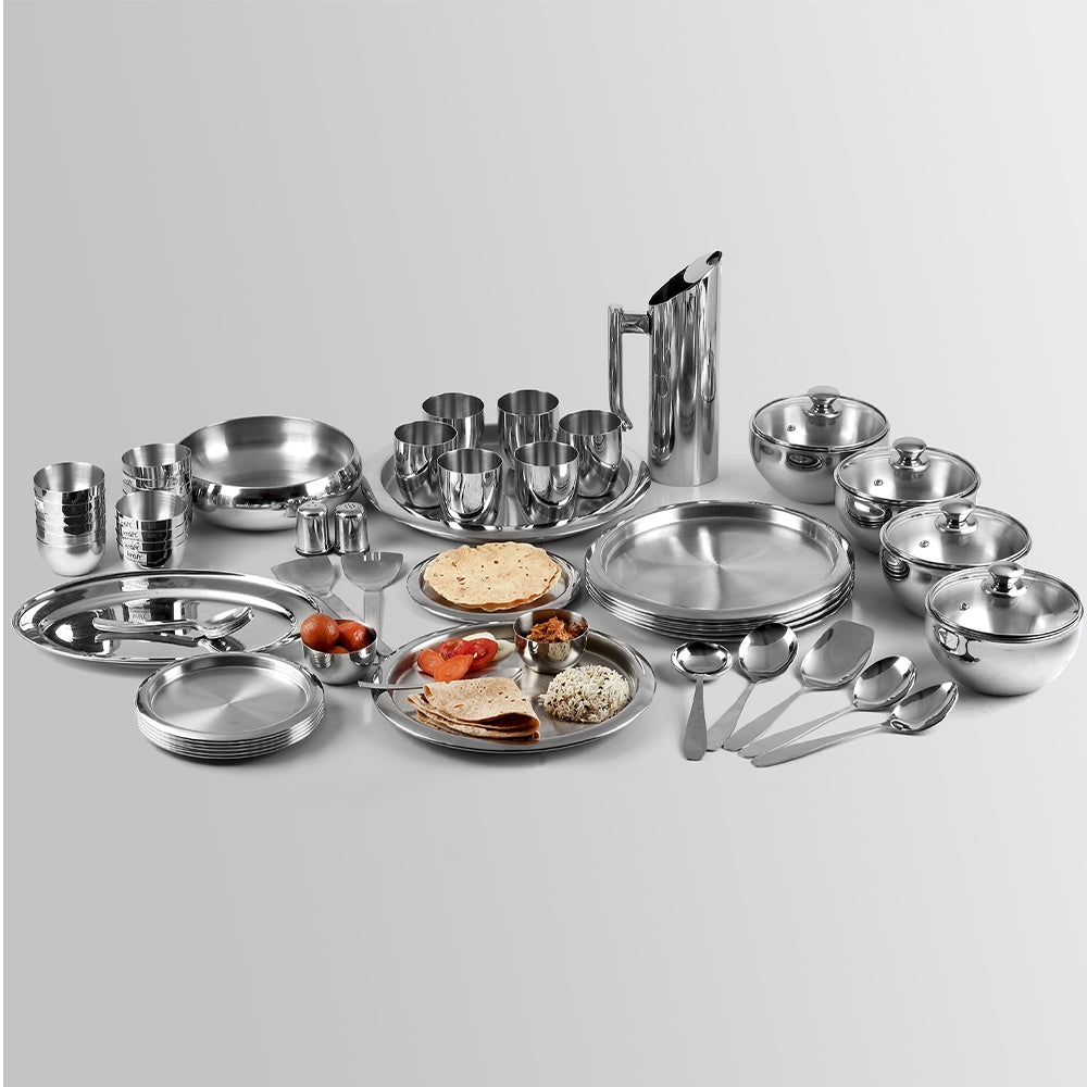 Premium 63-piece dinner set neatly arranged in a perfectly aligned layout, showcasing a complete stainless steel dining collection